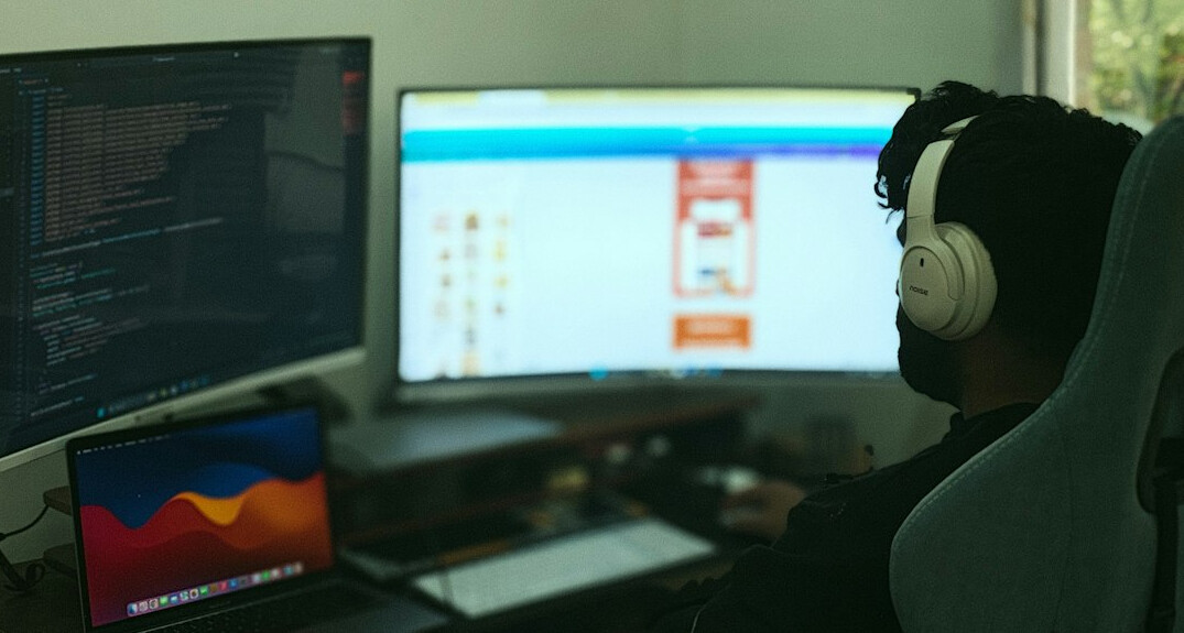 person writing code at home