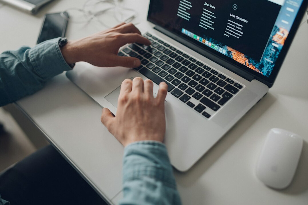 person learning coding on laptop