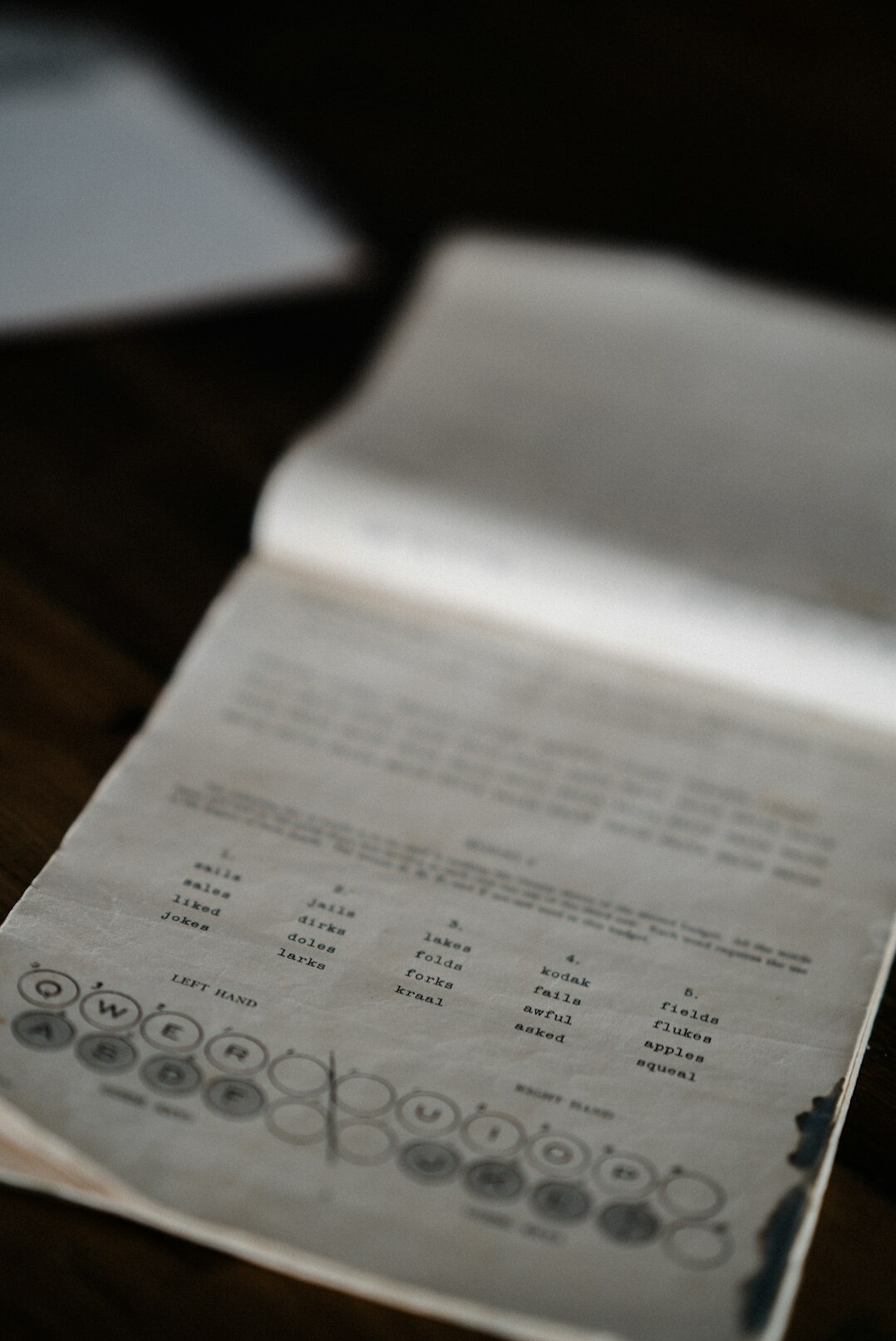 Open notebook with handwritten programming notes next to a laptop