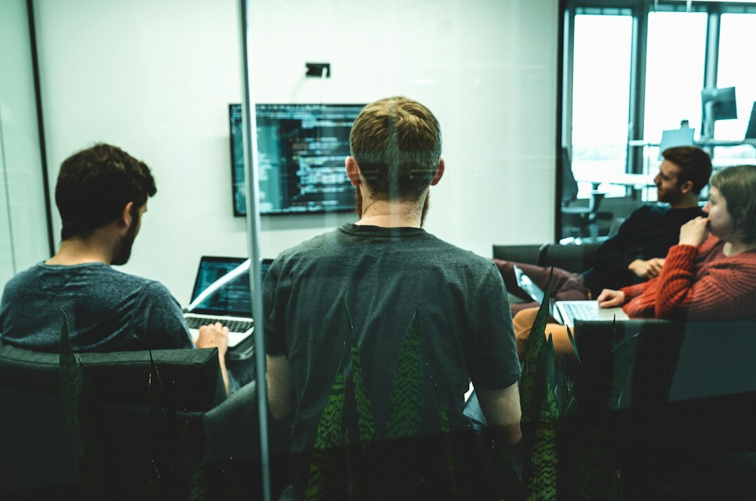 group of students discussing code