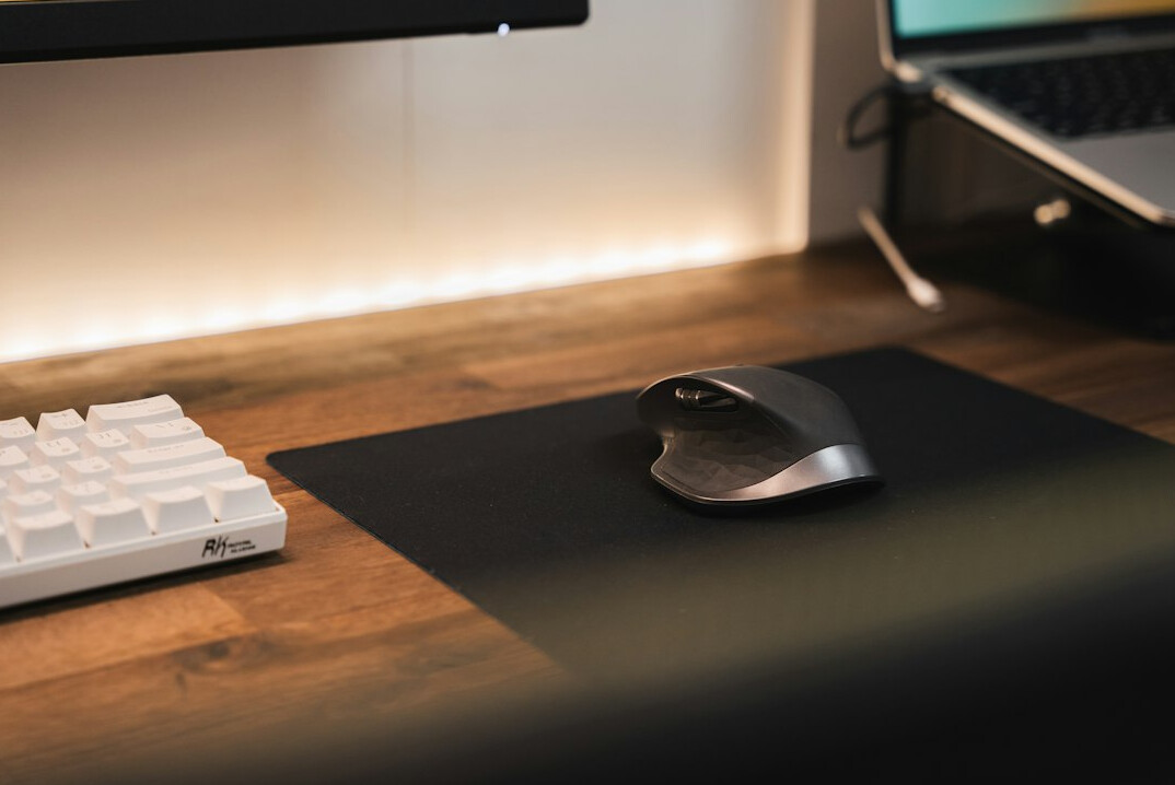 Calm minimal desk workspace with a notebook and cup of coffee